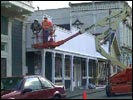 Installing a facade/sidewalk-cover on the Enterprise office across the street from Town Hall